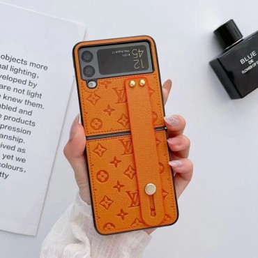 louis vuitton サムスンZ FLIP4ケースブランド 型押し柄 ルイヴィトン Samsung Z Flip3携帯カバー 滑り止め ギャラクシーz flipケース ハンドベルト GALAXY Z Flip3ケース 耐久性 多機能性 オシャレ 軽量 メンズ